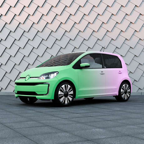 Compact car wrapped in TeckWrap matte purple to green gradient custom printed vinyl, parked against a modern tile wall backdrop.