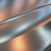 BMW wrapped in Teckwrap Satin Bond Gold (ECH17) vinyl, highlighting the luxurious satin gold finish under showroom lighting.