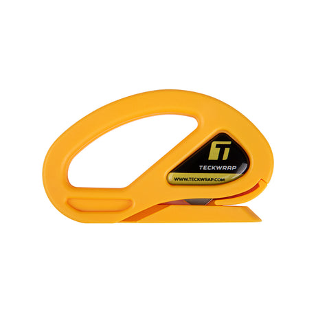 Close-up of TeckWrap Safety Cutter in bright orange with ergonomic grip and built-in concealed blade for safe and precise vinyl cutting.
