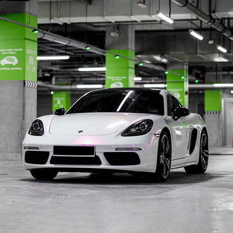 Front-angle view of a sports car wrapped in Teckwrap Lavender Pearl (CK526-HD) gloss vinyl wrap, clearly highlighting its luxurious, glossy lavender pearl finish.