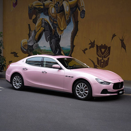 Maserati wrapped in Pink Sakura Gloss Vinyl Wrap by TeckWrap, displaying an elegant pastel pink transformation, ideal for automotive enthusiasts seeking a distinctive look.