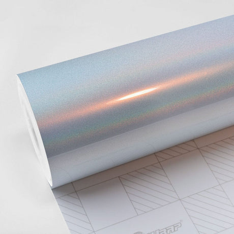Close-up view of TeckWrap White Fireworks (RCH03-HD) Vinyl Wrap showcasing its glossy, iridescent finish with subtle rainbow hues for car customization.