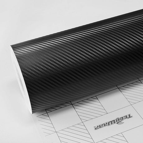 Close-up of Noir Black Carbon (CF01) Vinyl Wrap roll showcasing its detailed carbon fiber texture by TeckWrap.
