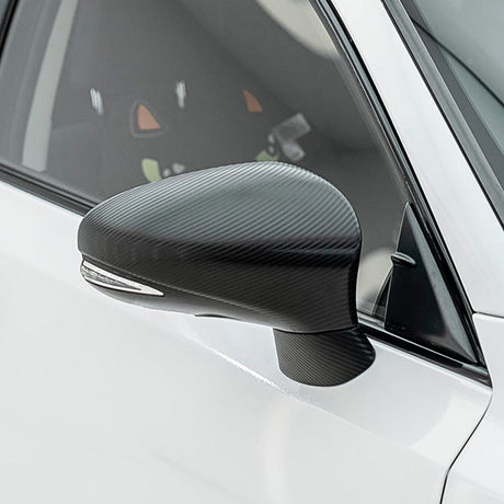 Side mirror wrapped with TeckWrap Pitch Black Carbon (CF02), accentuating its authentic carbon fiber look and precision detail.