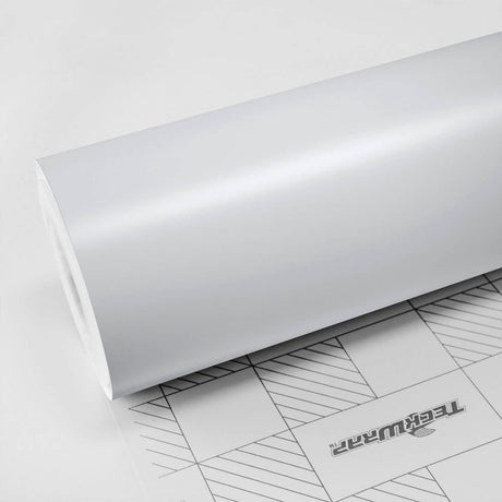 Close-up roll of Teckwrap White Matte (CM02) vinyl wrap, highlighting its smooth, non-reflective matte white finish.